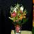 Modern style bouquet of pin cushion protea, orange star of bethleham, leucedendron and bear grass