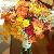 Fall bouquet of football mums, yellow pomps, red roses, mango callas, red hypericum