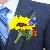 groom boutonniere of mini sunfower, safflower and delphenium